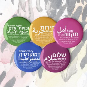 Peace, hope, democracy, liberty, human rights — a set of five original pin badges (3,18 cm. = 1,25 inches)