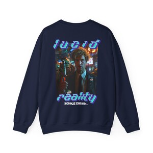 May include: Navy blue long-sleeve sweatshirt with a graphic print of a man in a dark suit and tie. The graphic has the text "lucid reality" in a blue and purple font.