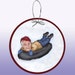 Danielle Newcomb reviewed Ron Paul Tubing on a Snowy Winter Day Paper Ornament