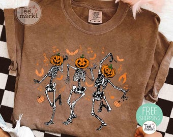 ダンシングスケルトンシャツ、コンフォートカラーズ®ハロウィンシャツ、キュートな秋冬レディースシャツ、不気味な季節のTシャツ、魔女シャツ、レトロなパンプキンTシャツ