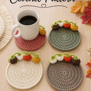 May include: Four round crochet coasters in dusty rose, sage green, cream, and taupe, each featuring a decorative vine with small multi-coloured pumpkins along the top edge. The text Ceochet Pattern is displayed at the top of the image.