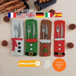 May include: A selection of crocheted Christmas cutlery holders in white, green, brown, and red. Each holder features a festive design, including a snowman, elf, gingerbread person, and Santa Claus. Each holder contains a fork and knife.