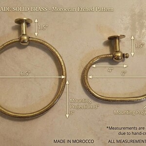 A product dimension guide for a brass towel hanger and TP holder,showing measurements in inches for easy bathroom installation