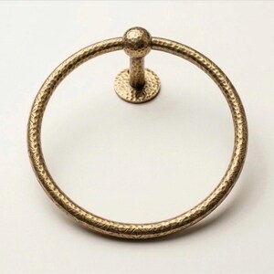 Measurement guide for hammered brass towel holder and toilet ring in inches, highlighting the handcrafted texture and mounting sizes