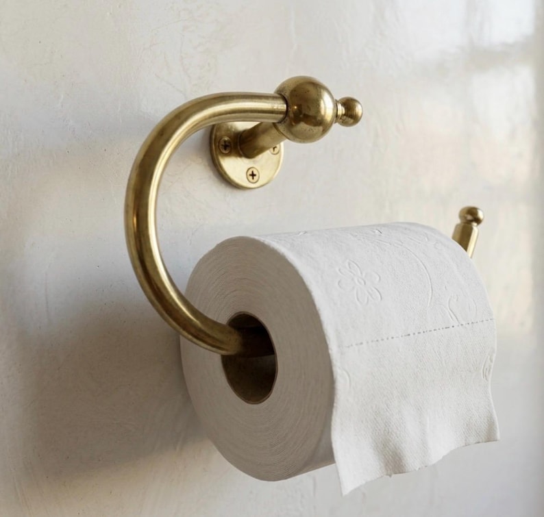 Artisan-made polished brass hand towel ring, featuring a smooth surface and durable wall mount, crafted by skilled Moroccan metalsmiths