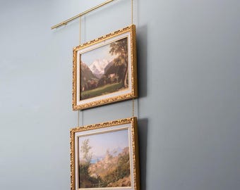 System do zawieszania obrazów na mosiężnej szynie: Regulowany stojak na obrazy ścienne