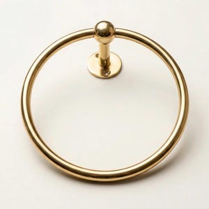 Artisan-made polished brass hand towel ring, featuring a smooth surface and durable wall mount, crafted by skilled Moroccan metalsmiths