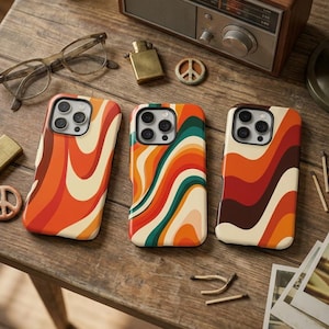 May include: Three smartphone cases featuring wavy, retro-inspired patterns in shades of orange, cream, dark green, and brown. Each case has a cutout for a multi-lens camera system. The designs consist of fluid, vertical, and diagonal stripes.