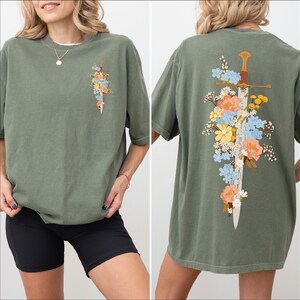Lifestyle look at Floral Sword Shirt Front Back Print Cottagecore Wildflower Graphic Tee Women on Comfort Colors 1717. Soft vintage wash, oversized unisex fit, garment-dyed cotton gift tee.