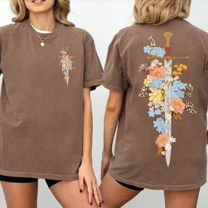 Another angle of Floral Sword Shirt Front Back Print Cottagecore Wildflower Graphic Tee Women on Comfort Colors 1717. Oversized vintage unisex tee, garment-dyed cotton, ready to gift.