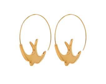 May include: Gold hoop earrings with a bird design. The earrings are made of a smooth, shiny metal.