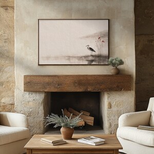 Japandi wall art digital print featuring a serene crane standing by calm water, surrounded by delicate red blossoms. Created in sumi-e ink style with earthy beige tones, it reflects Wabi Sabi simplicity and grace. Perfect printable artwork for minimalist or Scandinavian interiors.