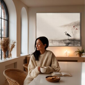 Elegant Japandi-inspired crane artwork in sumi-e ink painting style. The subtle red accents and muted earthy palette create a sense of stillness and natural beauty. Ideal printable wall decor for Wabi Sabi interiors or modern Scandinavian spaces.