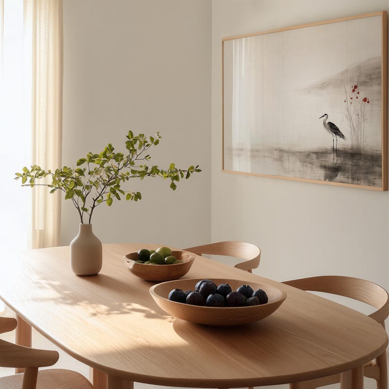 Digital Japandi wall art showing a crane standing gracefully beside tranquil water. The soft red floral accents and earthy ink tones bring warmth and calm to Wabi Sabi-inspired decor. A perfect printable artwork for peaceful, modern interiors.