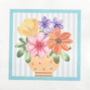 May include: A needlepoint canvas featuring a bouquet of yellow, purple, pink, and orange flowers in a peach-colored vase. The design is set against a background of vertical light blue stripes and framed by a solid light blue border.