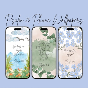 May include: Three phone wallpapers with watercolor backgrounds and Psalm 23 verses. The first wallpaper features a green and blue landscape with the verse "He leads me beside still waters". The second wallpaper features a green and white floral design with the verse "Surely your goodness and love will follow me all the days of my life". The third wallpaper features a blue and white floral design with the verse "He refreshes my soul".
