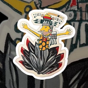 May include: A colorful sticker featuring a stylized figure with a feathered headdress and a large, fan-shaped tail. The figure is wearing a yellow and red costume with a sun symbol on the chest. The sticker is titled "Linda Timbrook Studio".