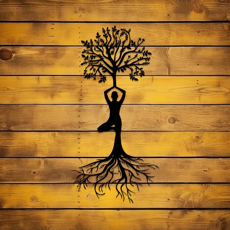 May include: A black silhouette of a person in a yoga pose with a tree growing out of their head and roots extending down. The background is a wood grain pattern.