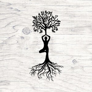 May include: A black silhouette of a person in a yoga pose with a tree growing out of their head and roots extending from their feet. The background is a white wood grain.