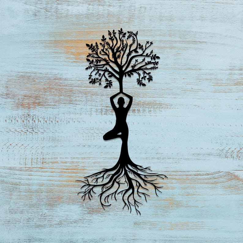 May include: A black silhouette of a person in a yoga pose with a tree growing out of their head and roots extending down from their feet. The background is a light blue wooden surface.