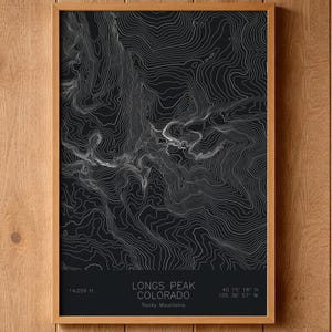 May include: A white ceramic mug with a black handle and the text "But First, Coffee" in a black, bold font. The mug is on a white surface.