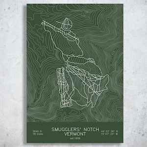 May include: A dark green rectangular print featuring a white topographic map of Smugglers' Notch, Vermont. The design includes white contour lines, trail paths, the text Smugglers' Notch Vermont, 3640 ft, 78 trails, est 1956, and coordinates.