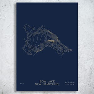 May include: A dark blue poster featuring a gold-colored topographic map of Bow Lake in New Hampshire. The text reads Bow Lake, New Hampshire, 65 ft, and the coordinates 43 14 56 N 71 10 33 W in a clean, sans-serif font at the bottom.
