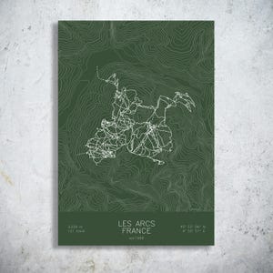 May include: A dark green poster featuring a white topographic map of Les Arcs, France. The design includes white contour lines, trail paths, and text reading LES ARCS FRANCE, 3,226 m, 121 trails, 45° 33' 06" N, 6° 50' 51" E, and est 1968.