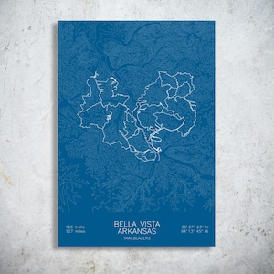 May include: A blue print of Bella Vista, Arkansas, with white trail outlines. The print includes the text "BELLA VISTA ARKANSAS TRAILBLAZERS" and coordinates. It also states "125 trails, 127 miles".
