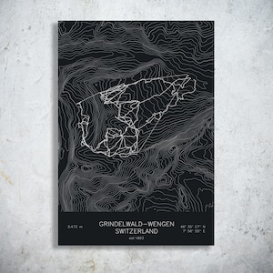 May include: A black topographic map print of Grindelwald-Wengen, Switzerland, featuring white contour lines and a central trail network. The text reads: GRINDELWALD-WENGEN, SWITZERLAND, 2,472 m, 46 35 27 N, 7 56 55 E, and est 1893.