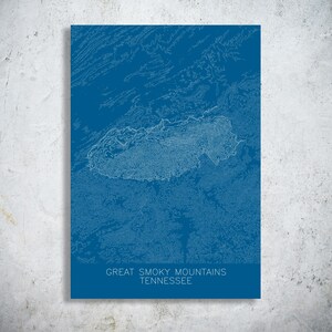 May include: A blue print of the Great Smoky Mountains in Tennessee. The map is a topographic representation with white contour lines. The text "GREAT SMOKY MOUNTAINS TENNESSEE" is printed in white at the bottom of the print.