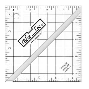May include: A clear, square quilting ruler with grid lines and measurements in inches. The ruler has a diagonal white edge and a black and white logo that reads "Bloc Loc". The text "www.blocloc.com" is also visible.