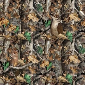 May include: Camouflage pattern featuring deer, tree trunks, and leaves in shades of brown, green, and tan. The design creates a woodland scene, suitable for hunting or outdoor-themed products. The image has a natural, earthy aesthetic.