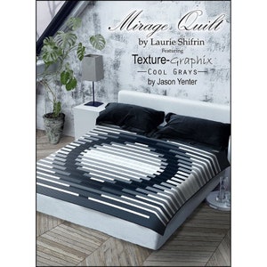 May include: A black and white quilt with a circular pattern in the center. The quilt is called "Mirage Quilt" by Laurie Shifrin, featuring "Texture-Graphix - Cool Grays" by Jason Yenter.
