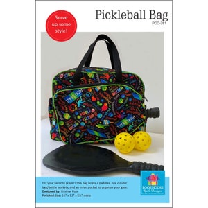 May include: A black and green pickleball bag with a colorful print of pickleball-themed words and images. The bag has two outer pockets and an inner pocket. The bag is 16 inches wide, 12 inches tall, and 5 and 1/2 inches deep.  "Serve up some style!" and "Pickleball Bag" are written in red and white text at the top of the image.  "PQD-261" is written in white text below the title.  "Poor House Quilt Designs" is written in white text on a blue and red house-shaped logo in the bottom right corner of the image.
