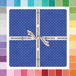 May include: A collection of fabric squares in various colors and patterns, including polka dots and gingham. A large blue square with white polka dots is the focal point, tied with a ribbon that reads "MAYWOOD STUDIO".