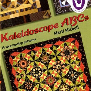 May include: A book cover titled "Kaleidoscope ABCs" by Marti Michell, featuring step-by-step quilt patterns. The cover displays colorful quilt blocks with geometric designs in shades of green, red, black, and yellow. A logo with a hand and heart is visible.