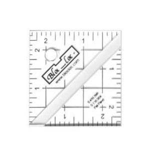 May include: A clear, square quilting ruler with black grid lines and measurements in inches. The ruler features a white diagonal line and the "Bloc-Loc" logo. The measurements are marked from 0 to 2 inches.