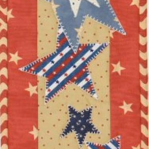 May include: A patriotic, vertical textile featuring a red background with white stars and a central beige panel. The panel showcases various blue, white, and red stars, creating a classic Americana design. The border has a striped pattern.