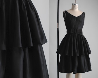 black early 1960s tiered ruffle cocktail dress