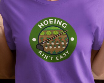 Hoeing Aint Easy Tee. Gardening T-Shirts for Plant Lovers: Unique Tees for Green Thumbs & Nature Fans.