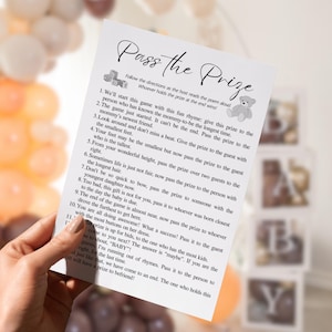 Pass The Prize Game Pass The Gift Poem Printable Baby Shower Games Left Right Baby Shower Party Games Pass The Prize Rhyme Game Template