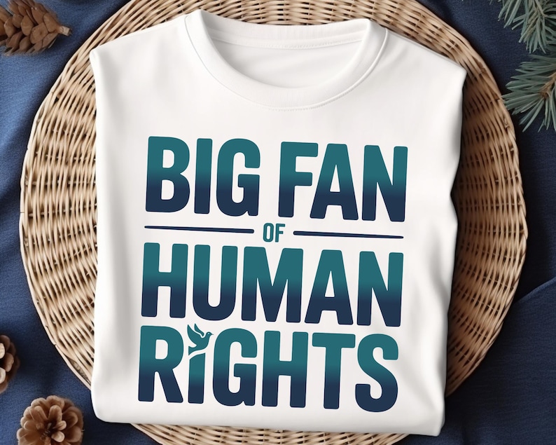shirt with bold “Big Fan of Human Rights” quote in gradient blue-green letters, featuring a peace dove icon; perfect for social justice advocates, activism events, equality supporters, and human rights awareness.