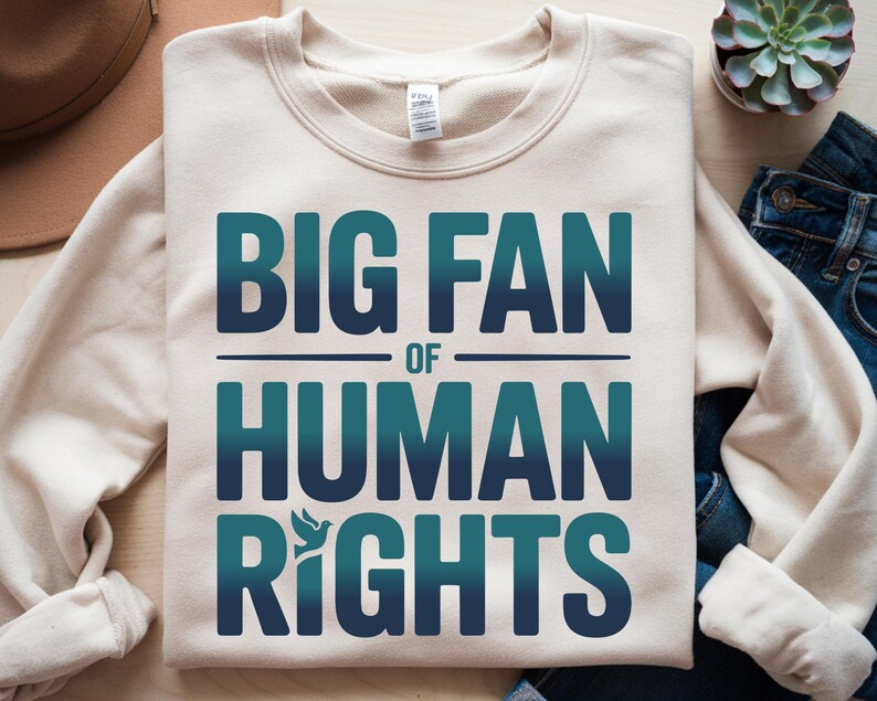 shirt with bold “Big Fan of Human Rights” quote in gradient blue-green letters, featuring a peace dove icon; perfect for social justice advocates, activism events, equality supporters, and human rights awareness.
