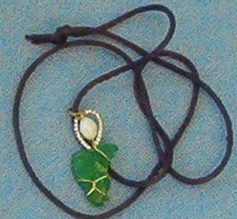 Green heart shaped Hawaiian beach glass pendant on cord image 1