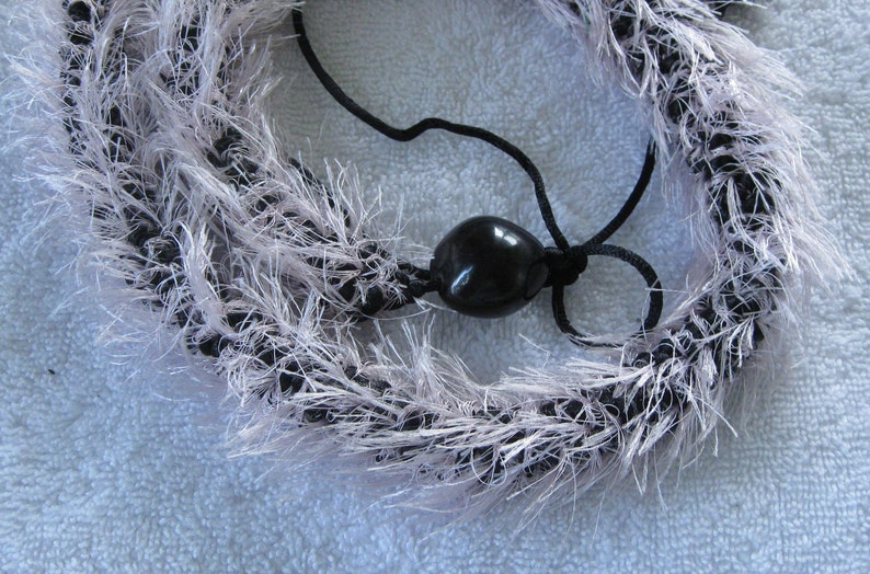 Black and light pink crocheted eyelash lei, finished with black kukui nuts, handmade in Hilo, Hawaii image 2