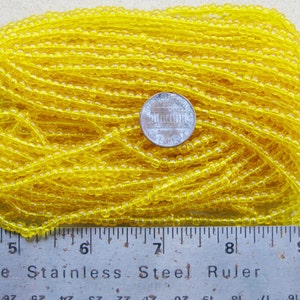 Czech Jablonex Ornela Preciosa seed beads, citrine color, 6/0, one full hank, temporarily strung image 1