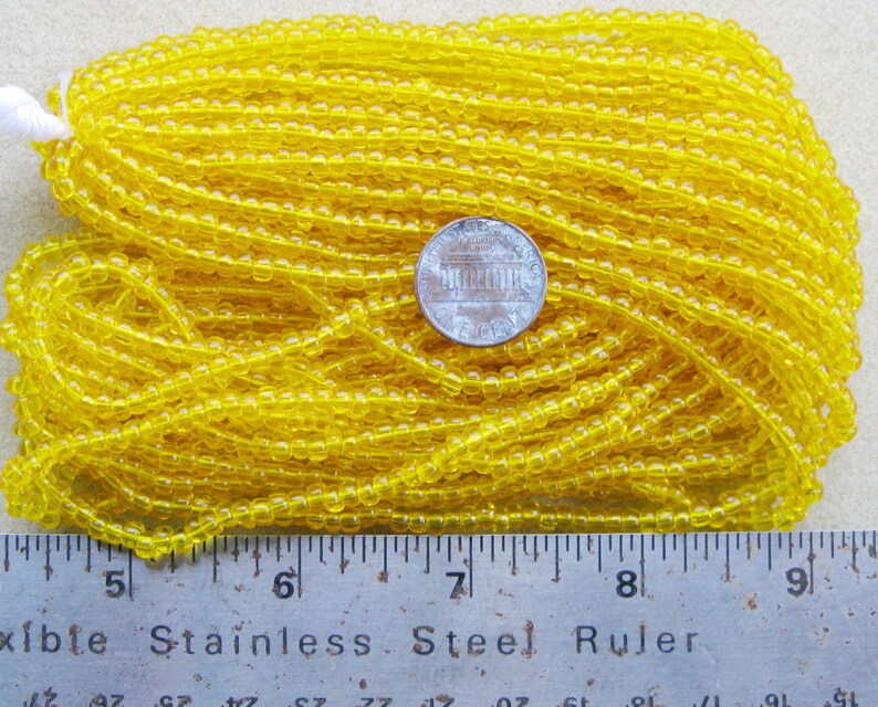 Czech Jablonex Ornela Preciosa seed beads, citrine color, 6/0, one full hank, temporarily strung image 1