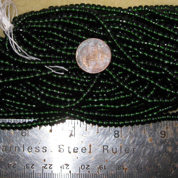 Czech Jablonex Ornela Preciosa seed beads, dark olivine, 6-ought, 4mm, full hank, dark green, temporarily strung