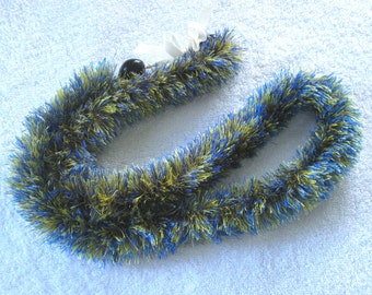 Blue and yellow eyelash lei, finished with black kukui nuts - handmade in Hilo, Hawaii